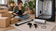 Checking unpacked equipment beside an empty grow tent